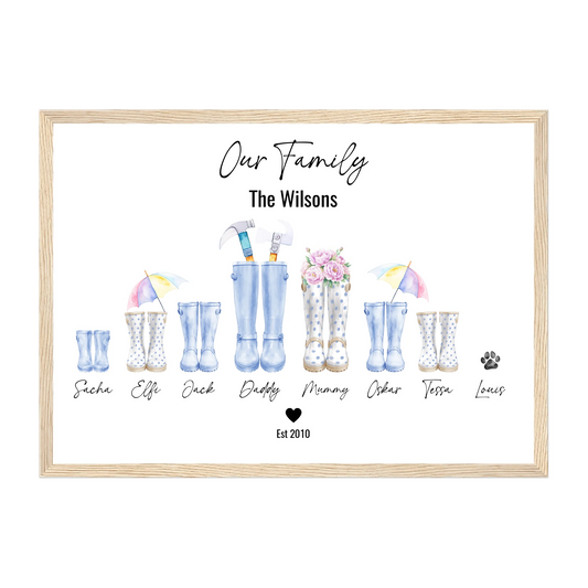 Framed personalised family wellington boot print with up to 8 custom boots (including pets), family name heading, and names beneath. Choice of boot styles, colours, and accessories. Natural wooden frame.
