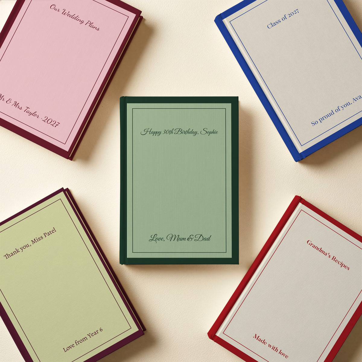 Five personalised classic border notebooks in sage green, pink, royal blue, red and pistachio with birthday, wedding and thank-you messages