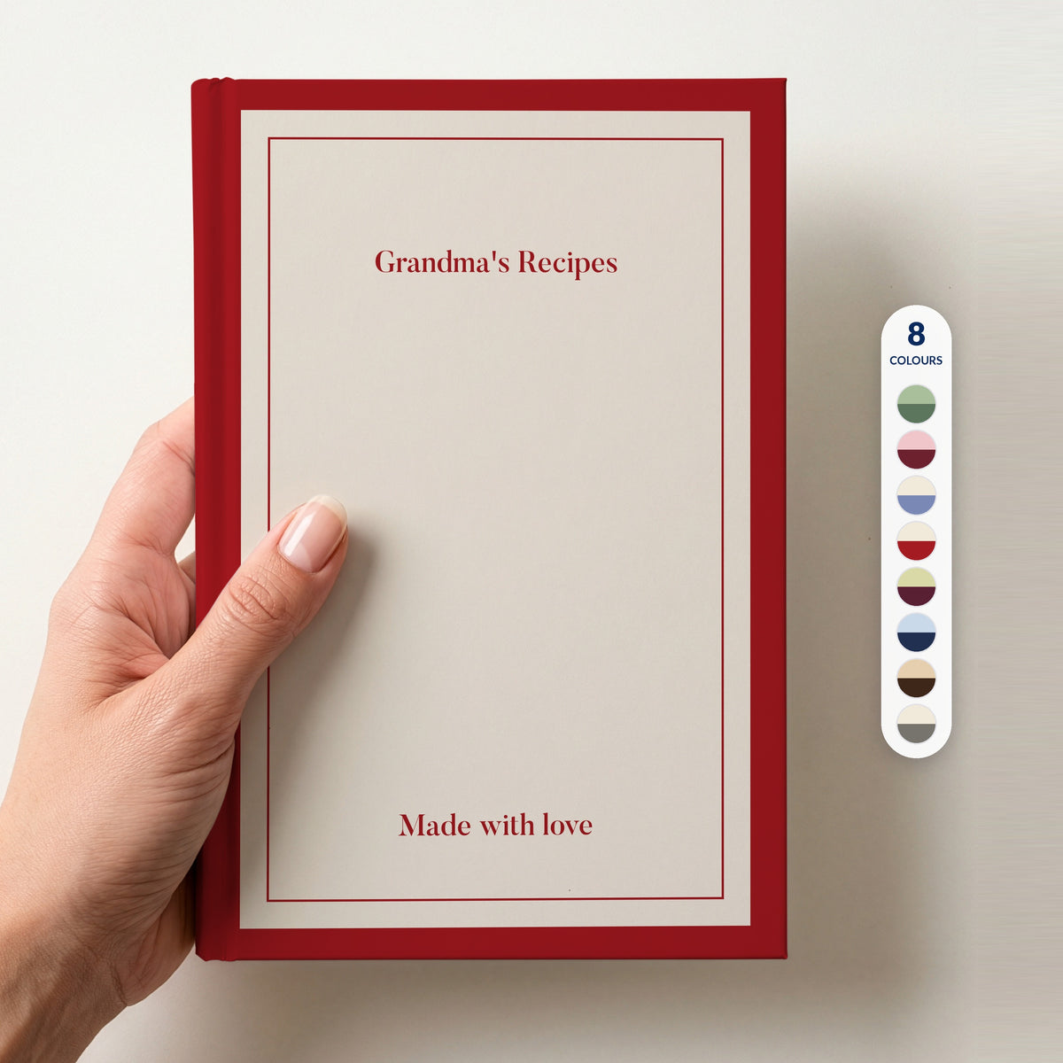 Hand holding a personalised cream notebook with a red border reading Grandma's Recipes and Made with love, beside a column of 8 colour swatches showing all 8 colourways