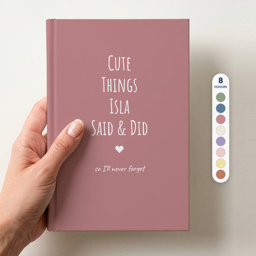 Hand holding a dusty rose personalised journal reading Cute Things Isla Said & Did, beside a column of 8 colour swatches showing all 8 colourways