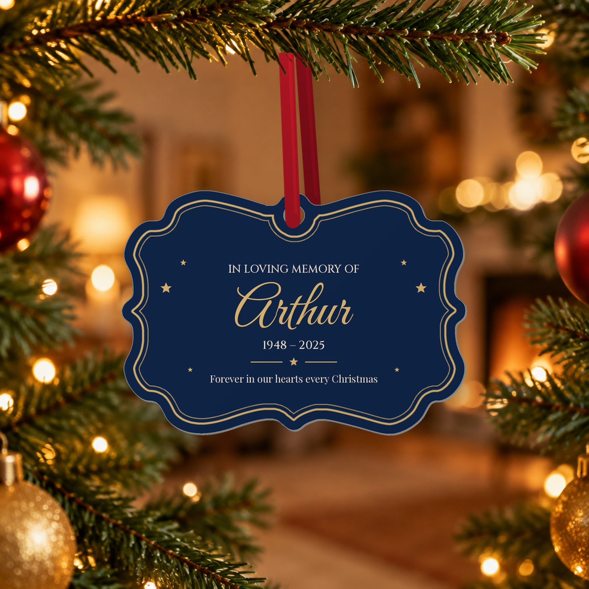 Navy memorial Christmas ornament for Arthur hanging from a red ribbon on a Christmas tree in front of a cosy fireplace